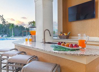 Outdoor kitchen and grilling station